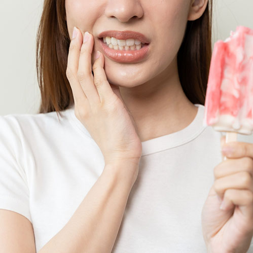 Women with ice cream and toothache